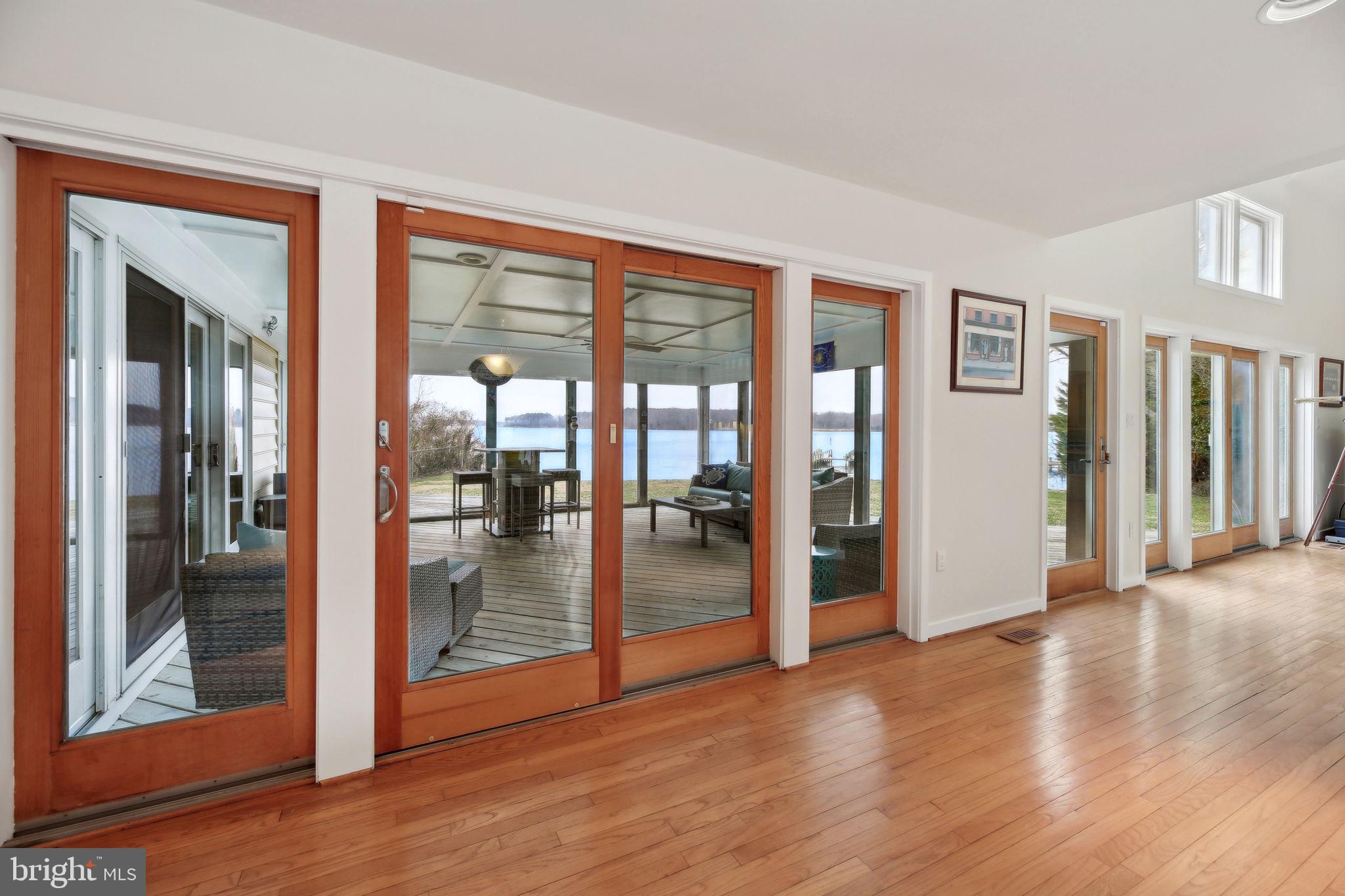1601 Cliff Drive Edgewater, MD 21037 - Photo 33 of 86 a view of a big room with wooden floor and windows