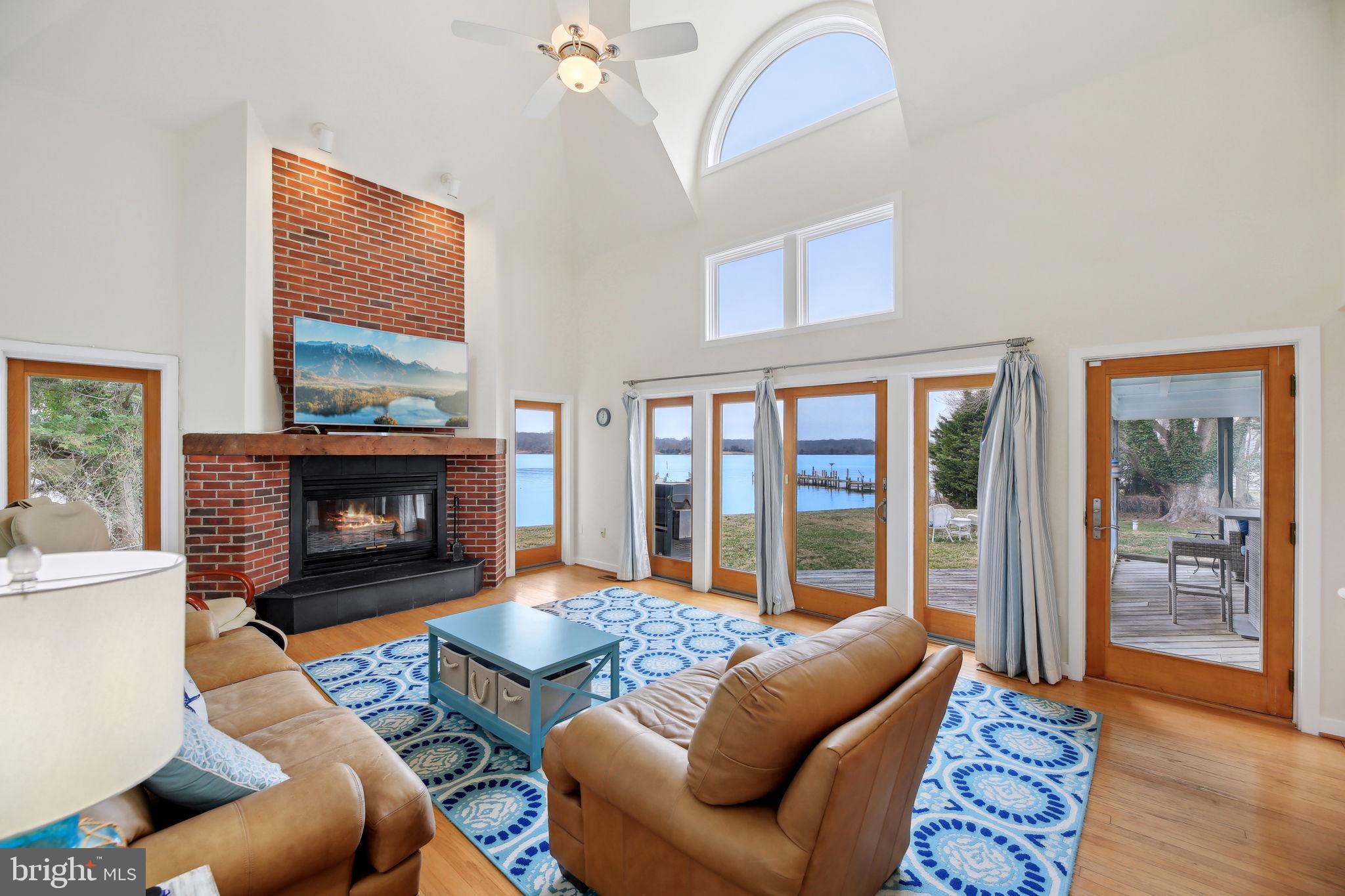 1601 Cliff Drive Edgewater, MD 21037 - Photo 35 of 86 a living room with furniture and a fireplace
