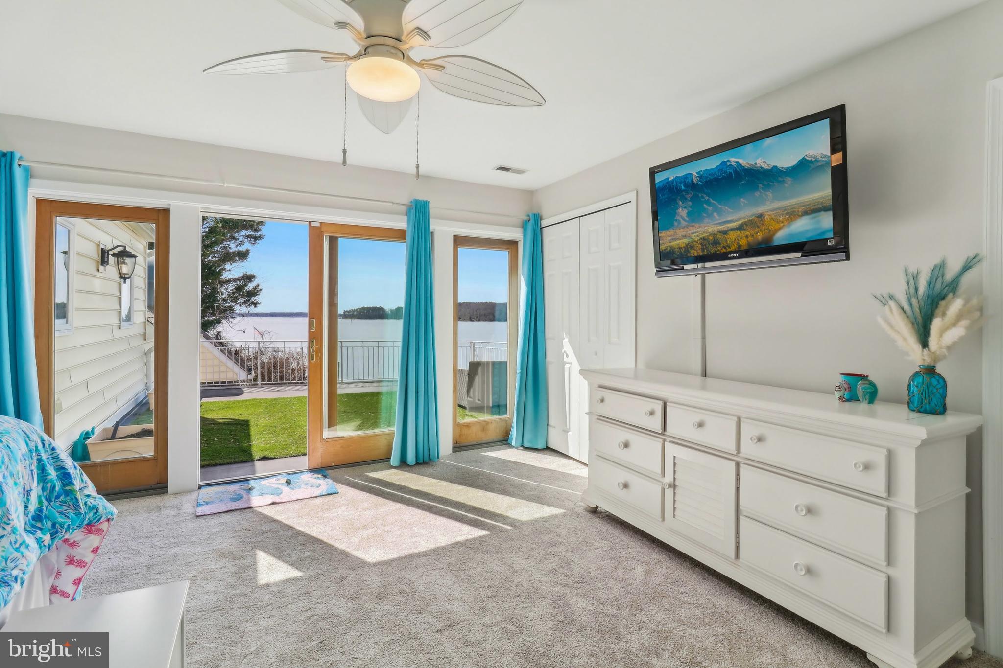 1601 Cliff Drive Edgewater, MD 21037 - Photo 40 of 86 a bedroom with a large bed and a chandelier