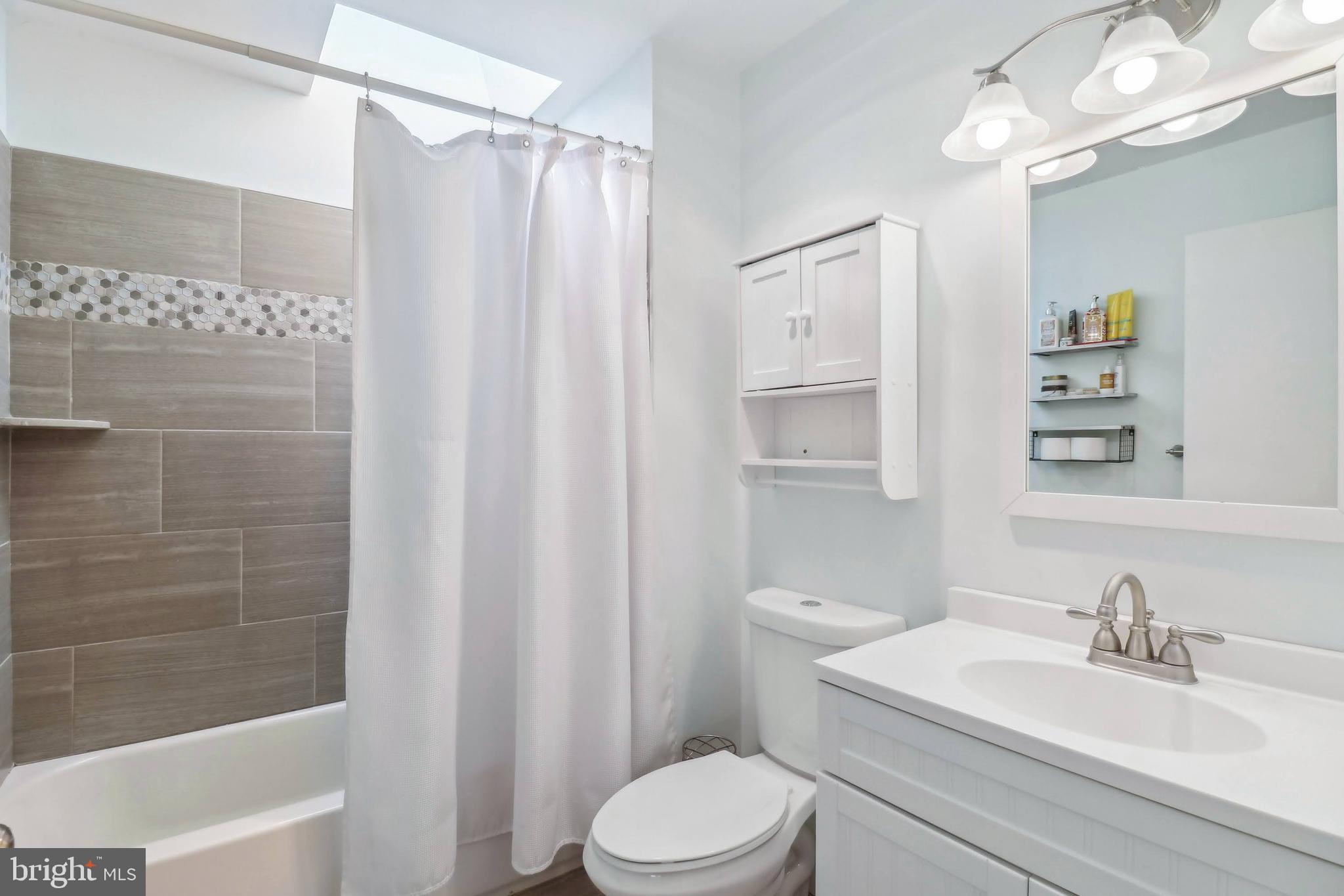 1601 Cliff Drive Edgewater, MD 21037 - Photo 54 of 86 a bathroom with a sink a toilet and shower