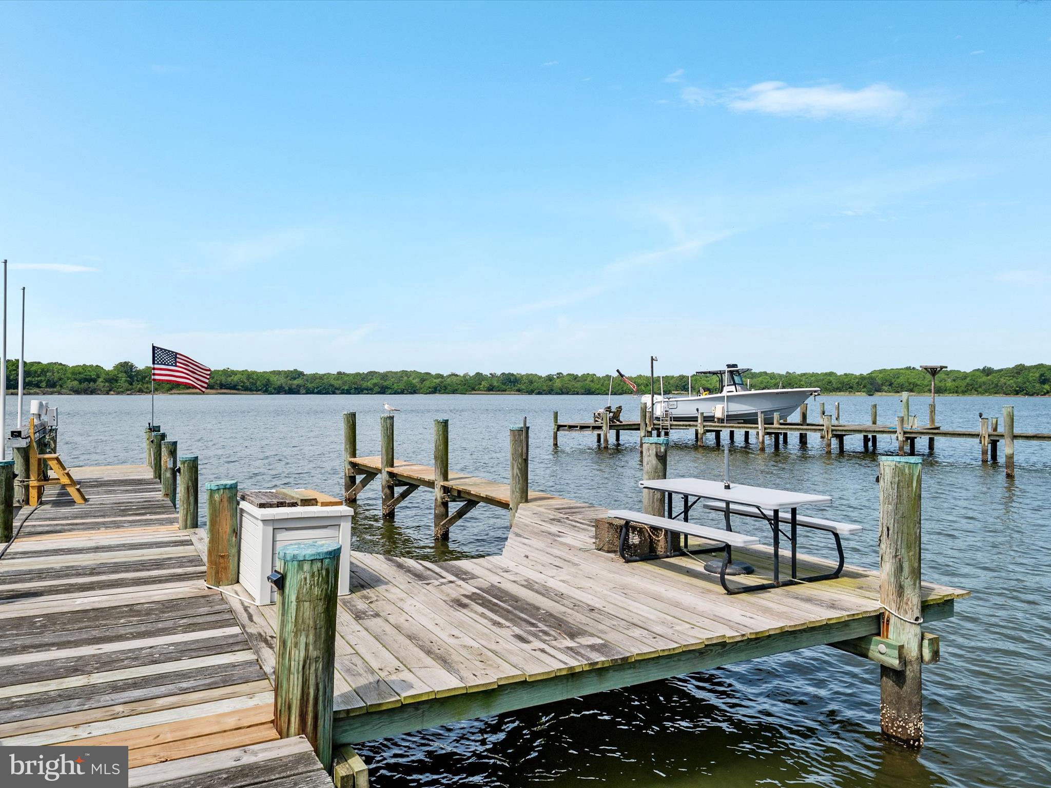 1601 Cliff Drive Edgewater, MD 21037 - Photo 74 of 86 a view of a lake with boats and trees in the background