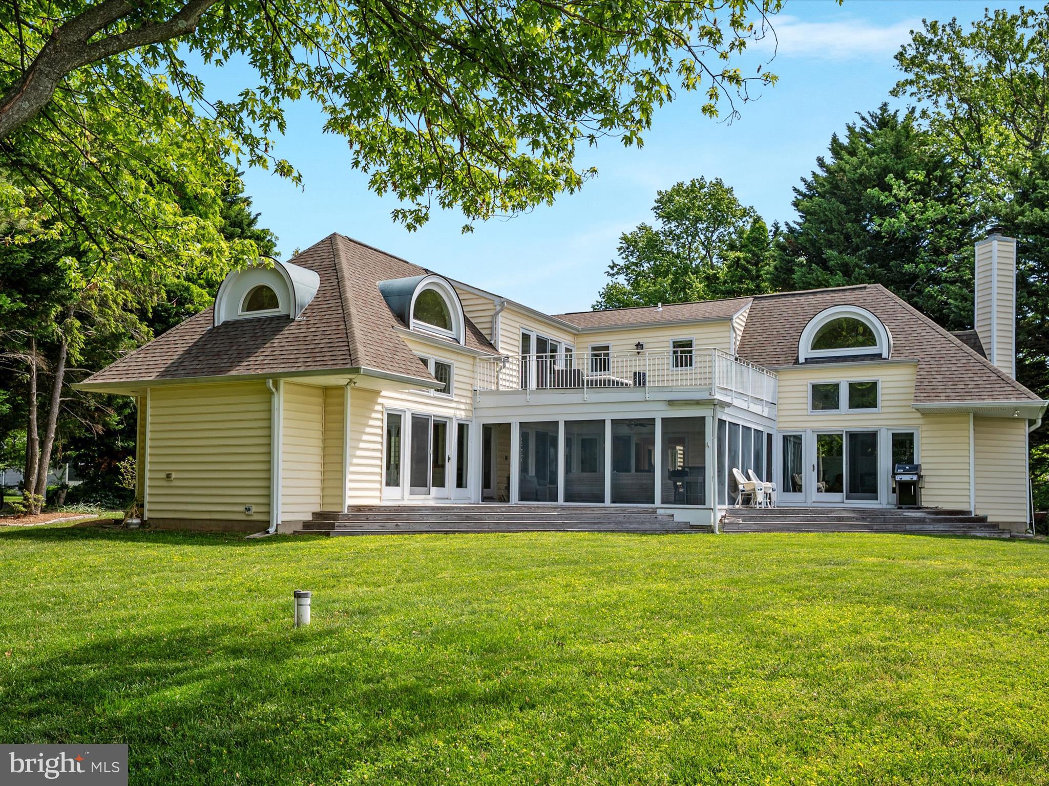 1601 Cliff Drive Edgewater, MD 21037 - Photo 8 of 86 a front view of a house with a yard table and chairs
