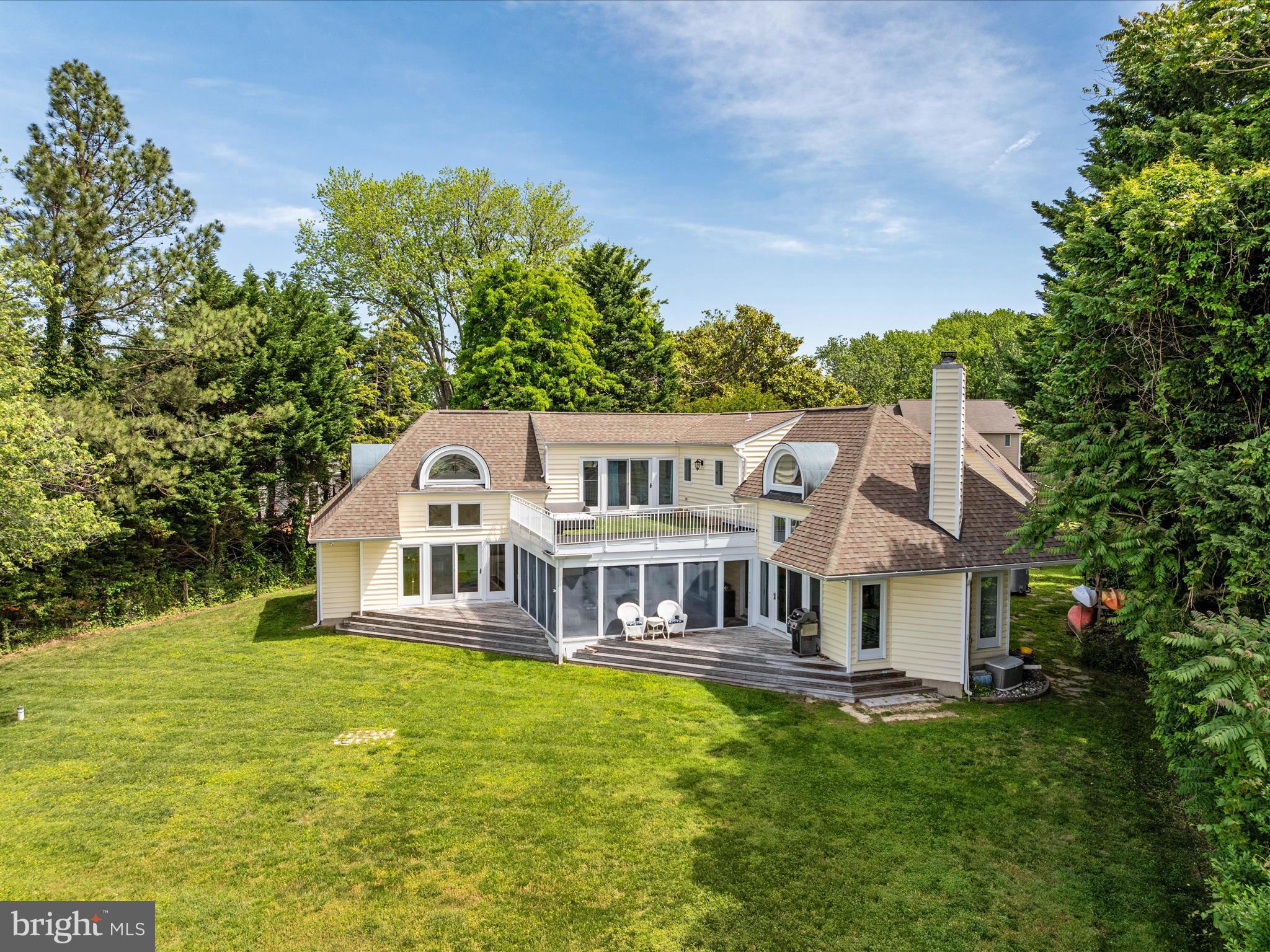 1601 Cliff Drive Edgewater, MD 21037 - Photo 10 of 86 a front view of house with yard and trees in the background
