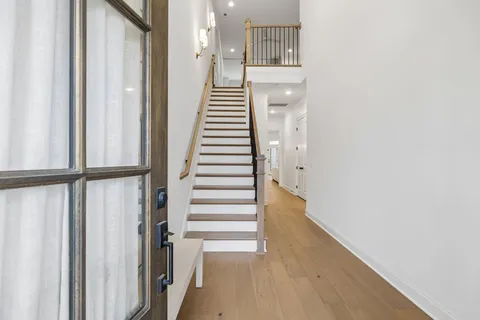 a view of entryway with wooden floor