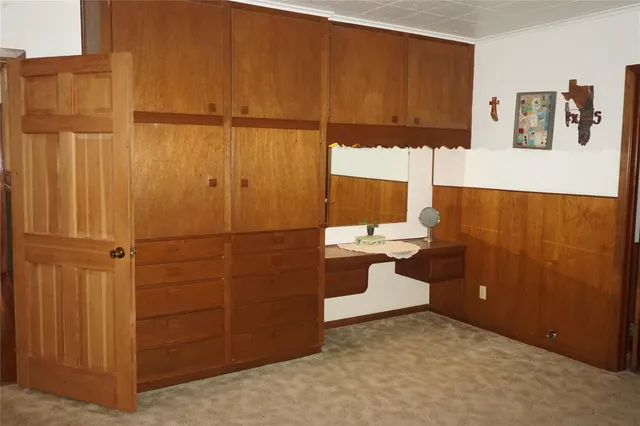 a bathroom with a double vanity sink a toilet a mirror and shower