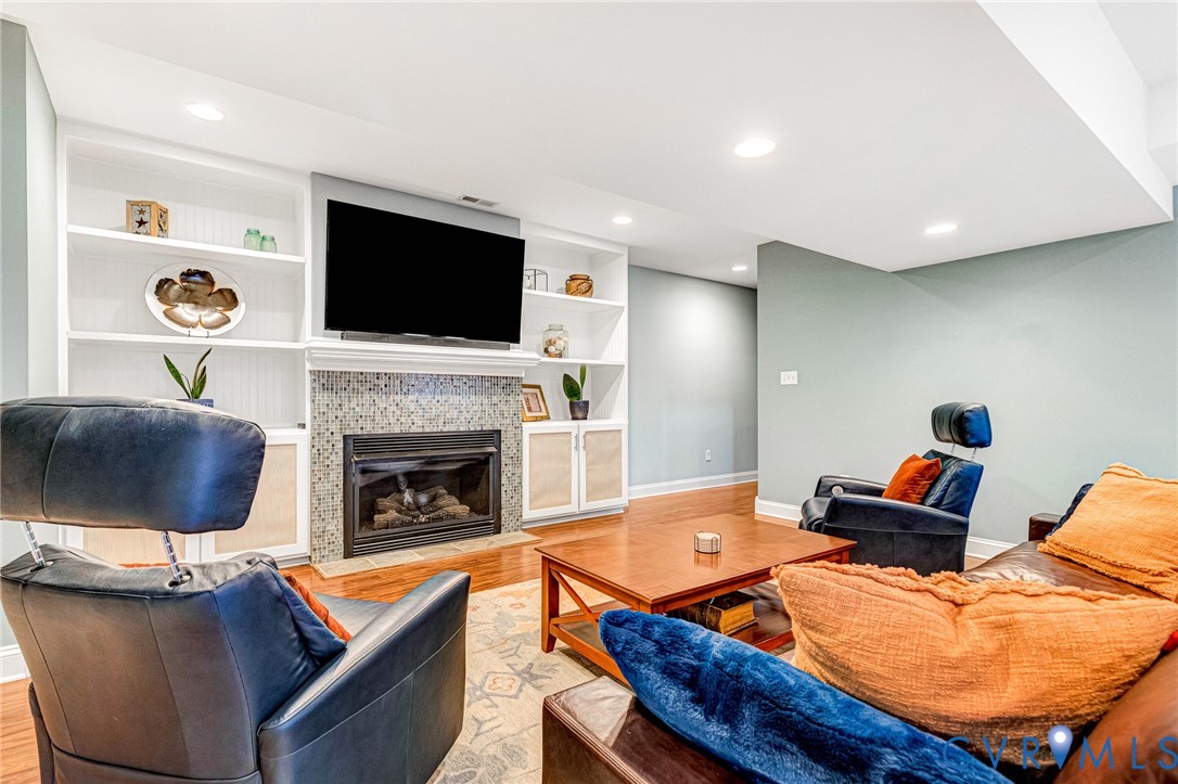 14436 Overlook Ridge Lane Beaverdam, VA 23015 - Photo 44 of 82 Basement Rec Room with gas fireplace & built-ins!