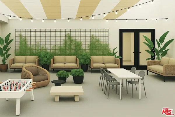 a balcony with furniture and a potted plant