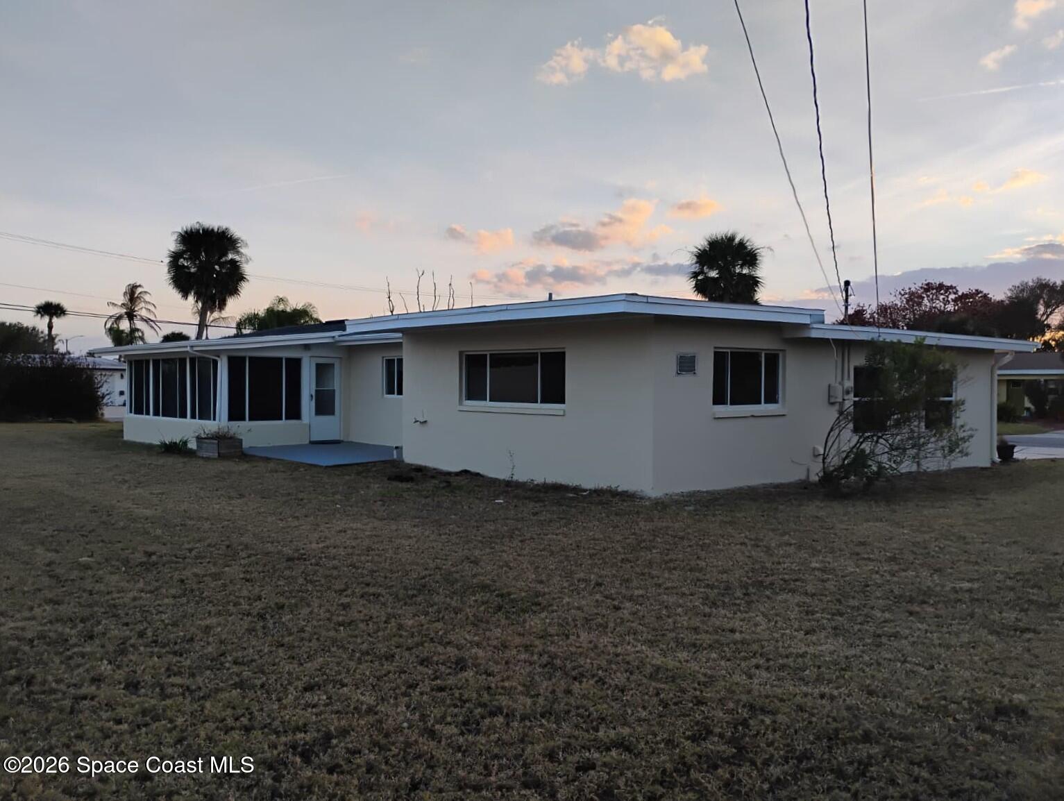 2310 Reef Avenue Indialantic, FL 32903 - Photo 2 of 13 a view of a house with backyard and sitting area