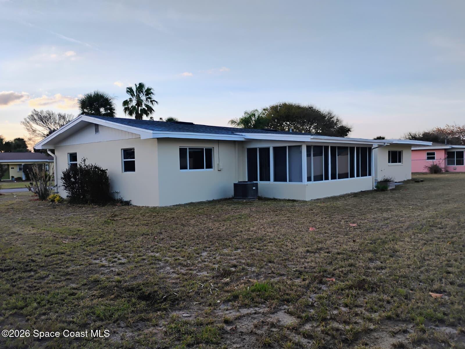 2310 Reef Avenue Indialantic, FL 32903 - Photo 3 of 13 a view of a house with backyard and sitting area
