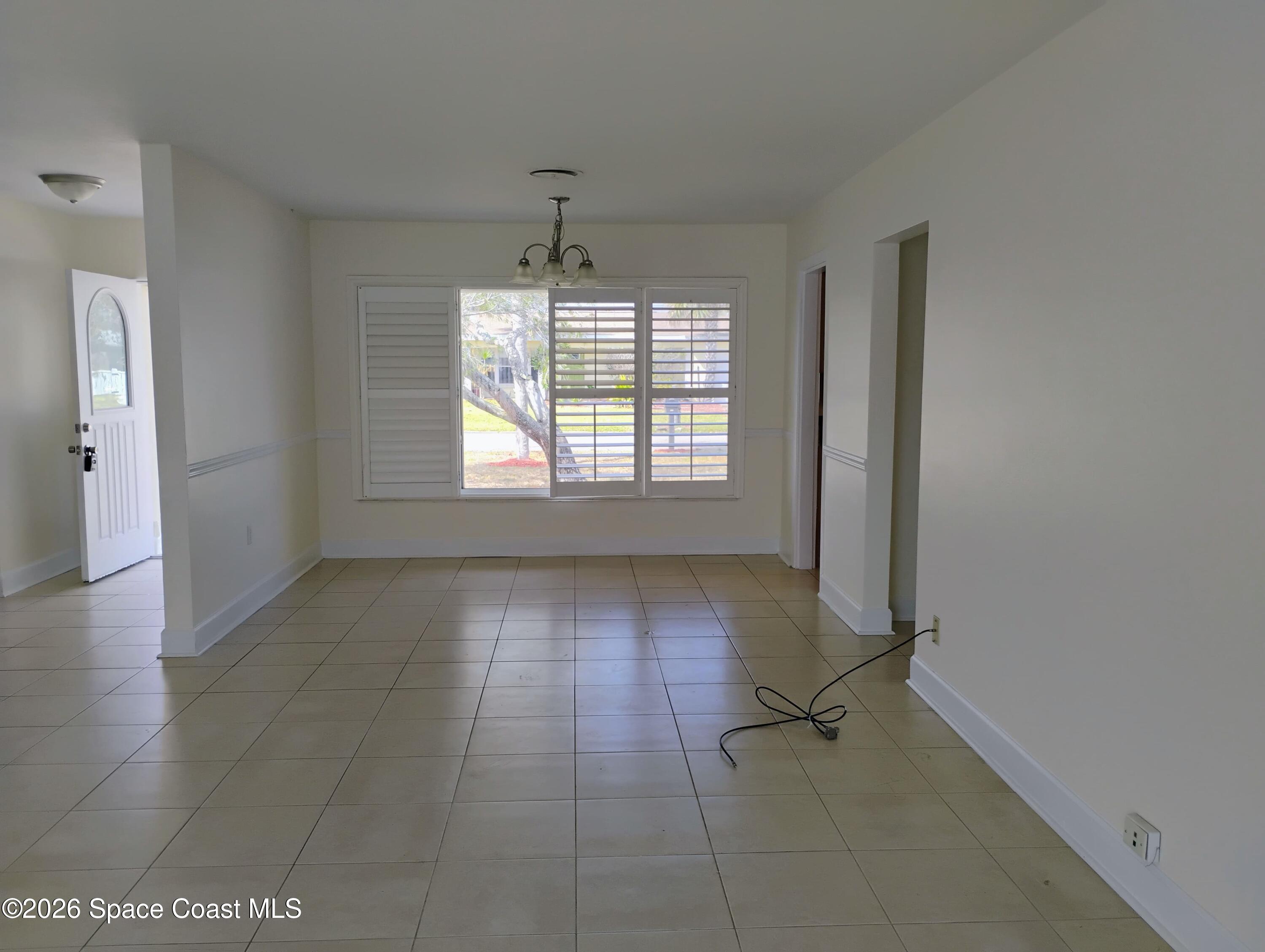 2310 Reef Avenue Indialantic, FL 32903 - Photo 5 of 13 a view of an empty room with a window