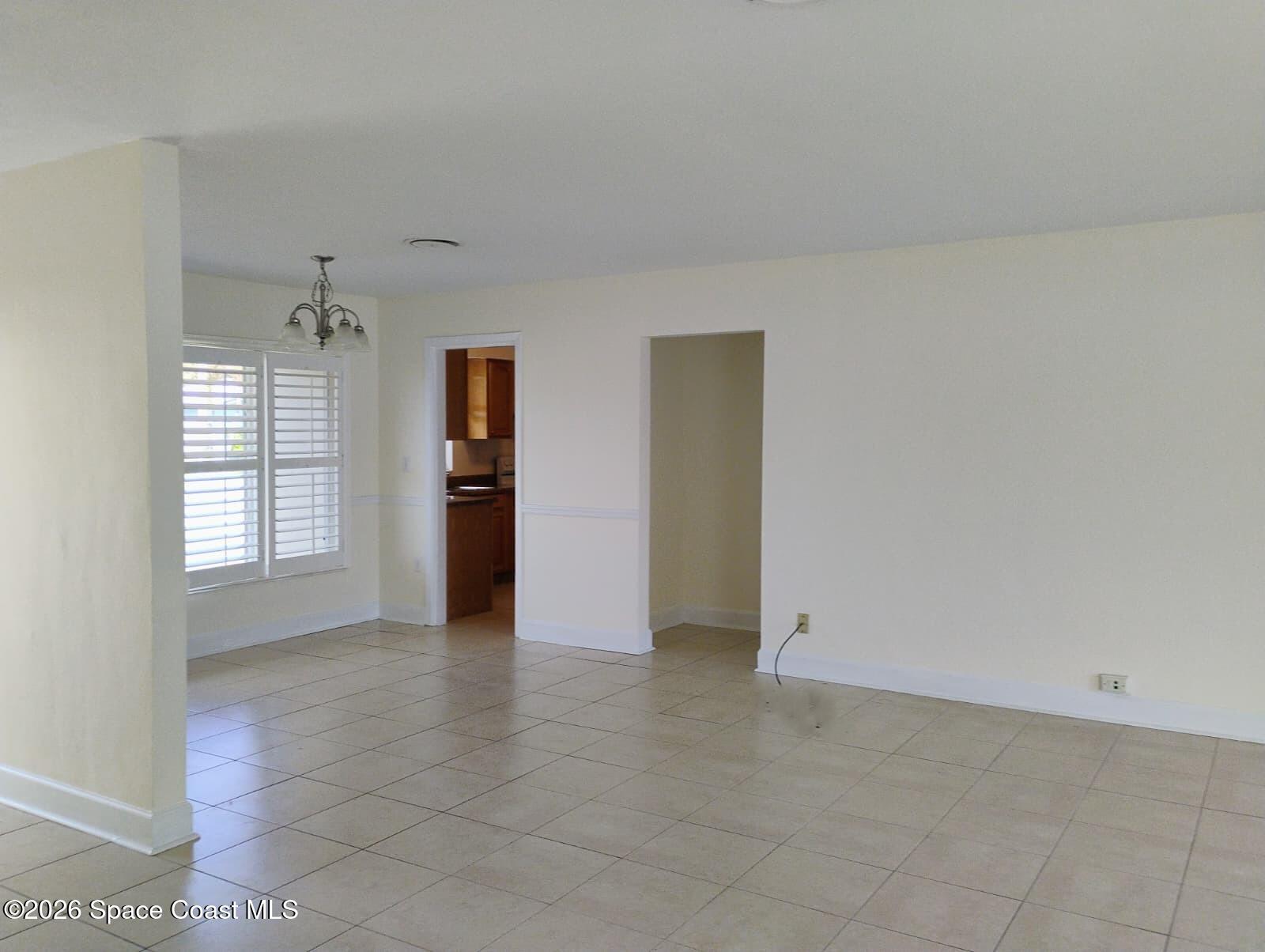 2310 Reef Avenue Indialantic, FL 32903 - Photo 7 of 13 a view of an empty room with a window