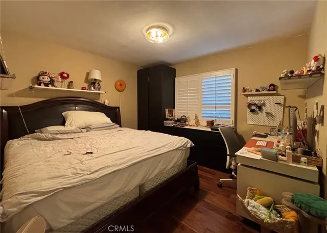 a bedroom with a bed and a dresser