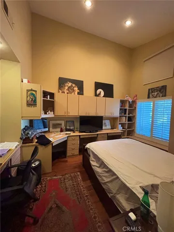 a bed room with a bed and furniture