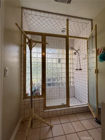 a view of a bathroom with a glass door