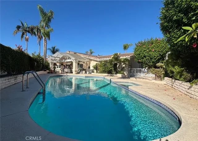 a view of a swimming pool with a patio