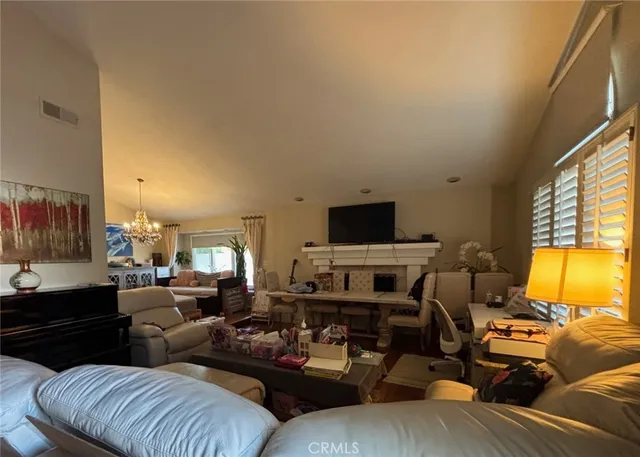 a living room with furniture fireplace and a flat screen tv