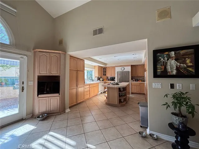 a living room with furniture a window and a flat screen tv