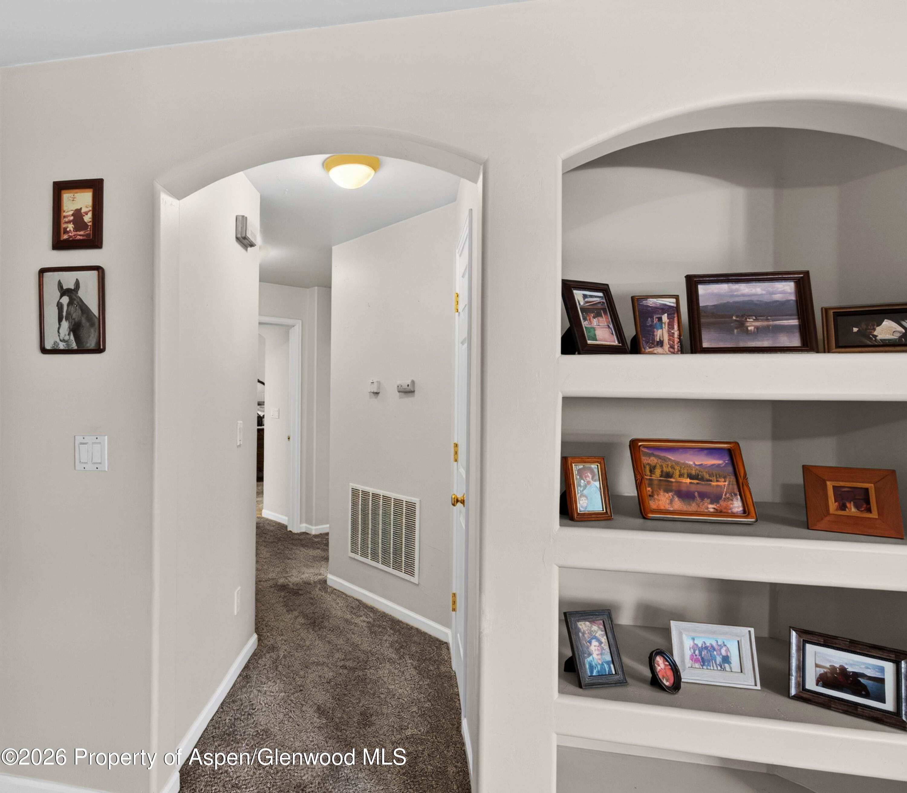 608 Lariat Loop New Castle, CO 81647 - Photo 24 of 32 a view of a hallway with shelves