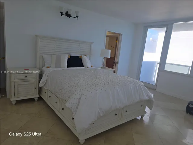 a bedroom with a bed and a tv