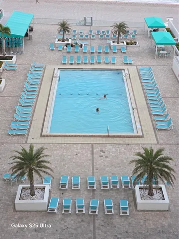 a view of multiple house with a swimming pool