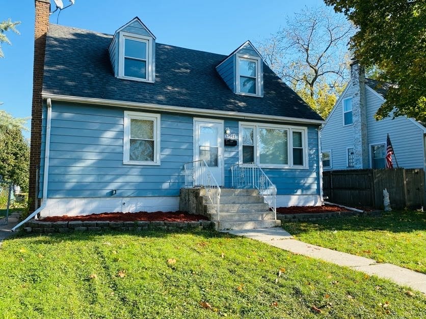 17543 Roy Street Lansing, IL 60438 - Photo 1 of 13 a front view of house with yard