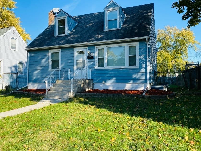 17543 Roy Street Lansing, IL 60438 - Photo 2 of 13 a view of a yard in front of house