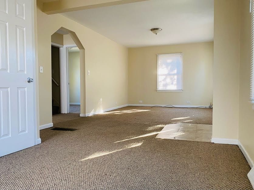 17543 Roy Street Lansing, IL 60438 - Photo 3 of 13 a view of a livingroom with a staircase