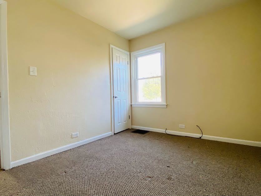 17543 Roy Street Lansing, IL 60438 - Photo 9 of 13 an empty room with a window