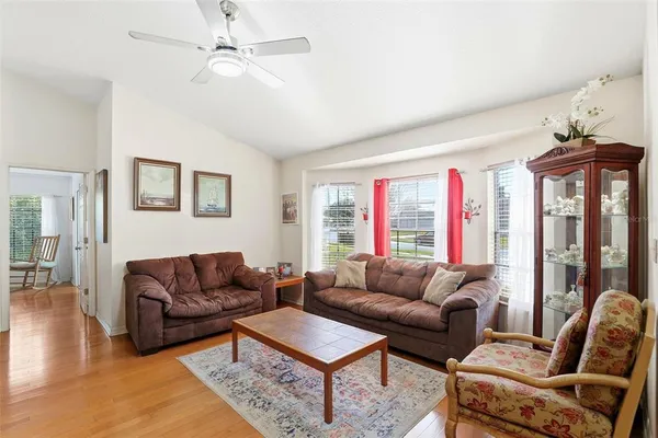 a living room with furniture and a large window