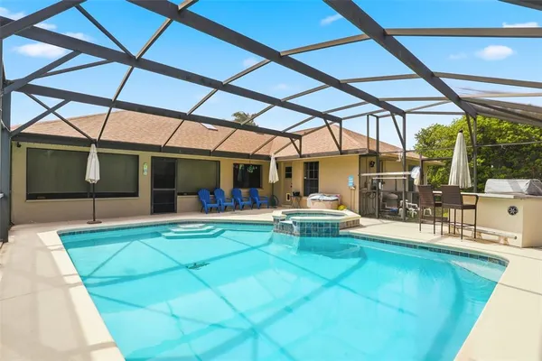 a view of a swimming pool with a patio