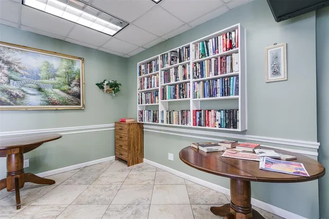 a room with furniture and book shelf