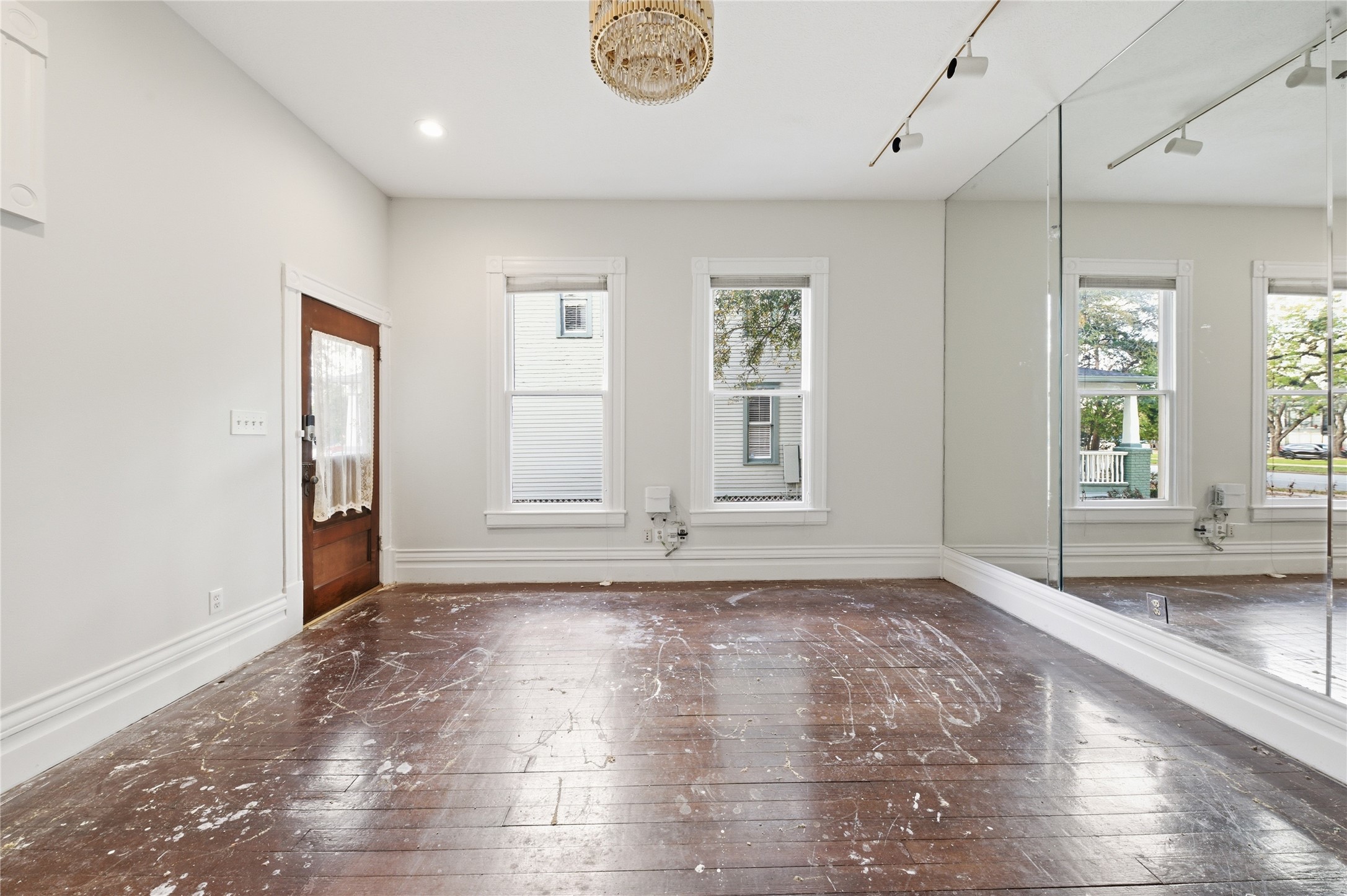 1007 Heights Boulevard Houston, TX 77008 - Photo 12 of 50 an empty room with wooden floor and windows