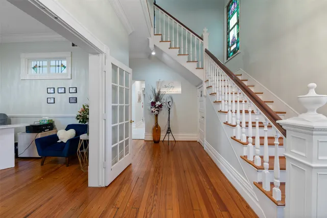 a view of entryway with wooden floor and stairs