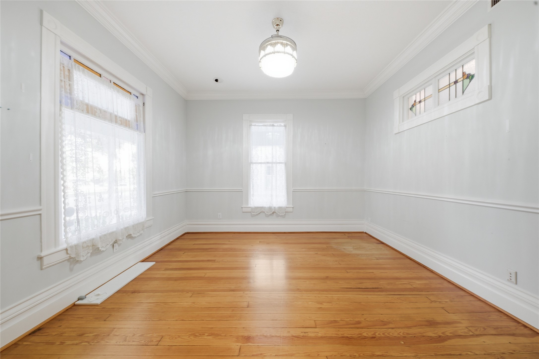 1007 Heights Boulevard Houston, TX 77008 - Photo 16 of 50 a view of empty room with wooden floor and fan