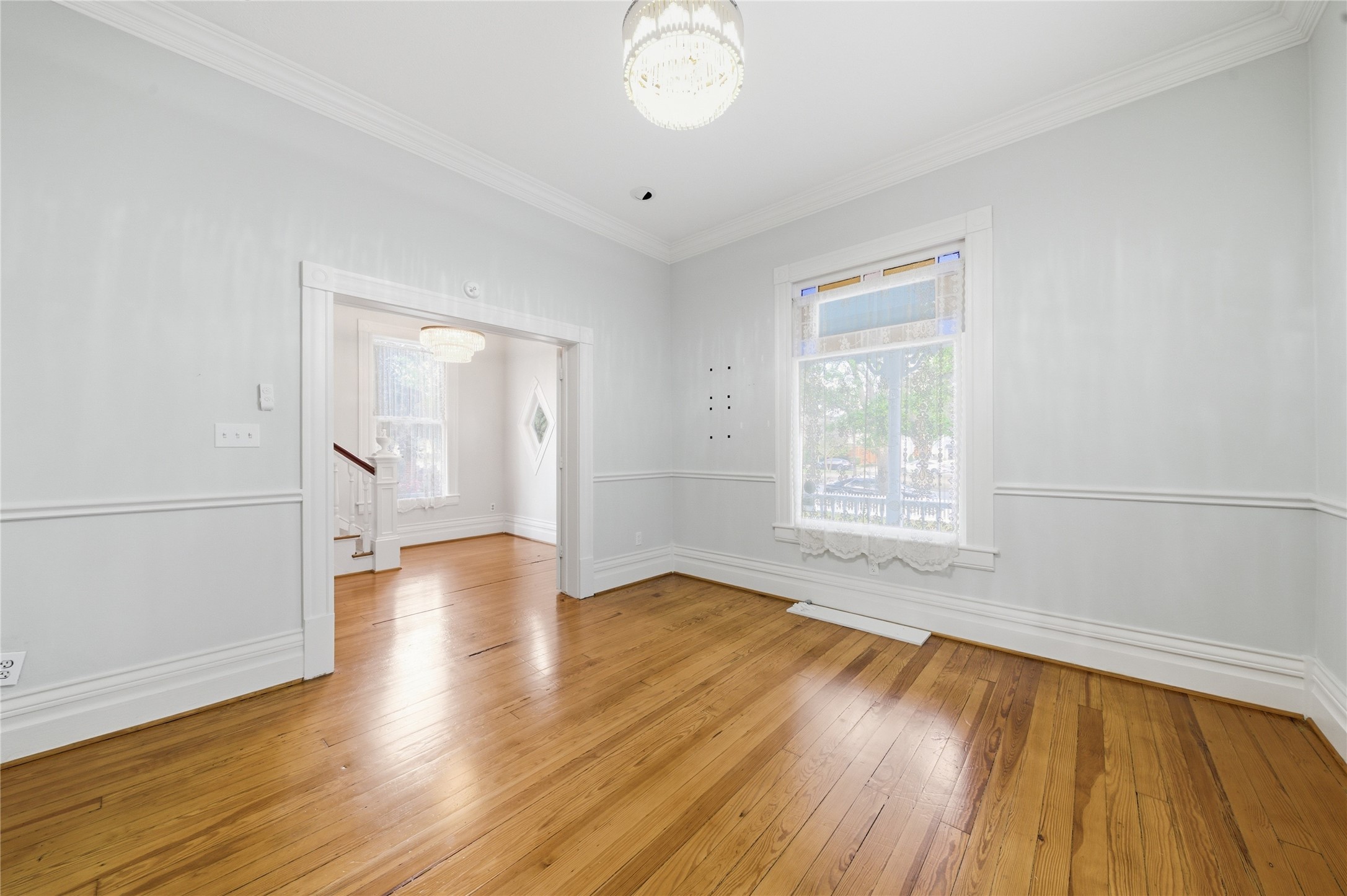1007 Heights Boulevard Houston, TX 77008 - Photo 19 of 50 an empty room with wooden floor and windows