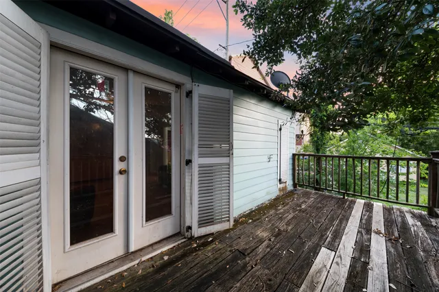 a balcony with a wooden floor