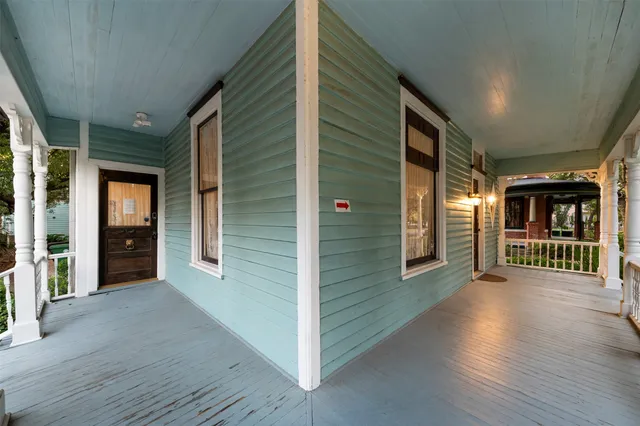 a view of a porch with wooden floor and stairs