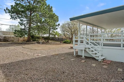 a view of a yard with a bench