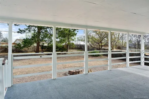 a view of an empty room with a large window