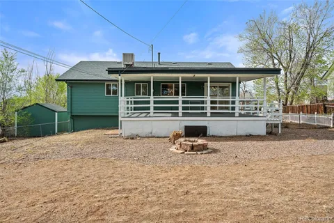 a front view of a house with sitting area