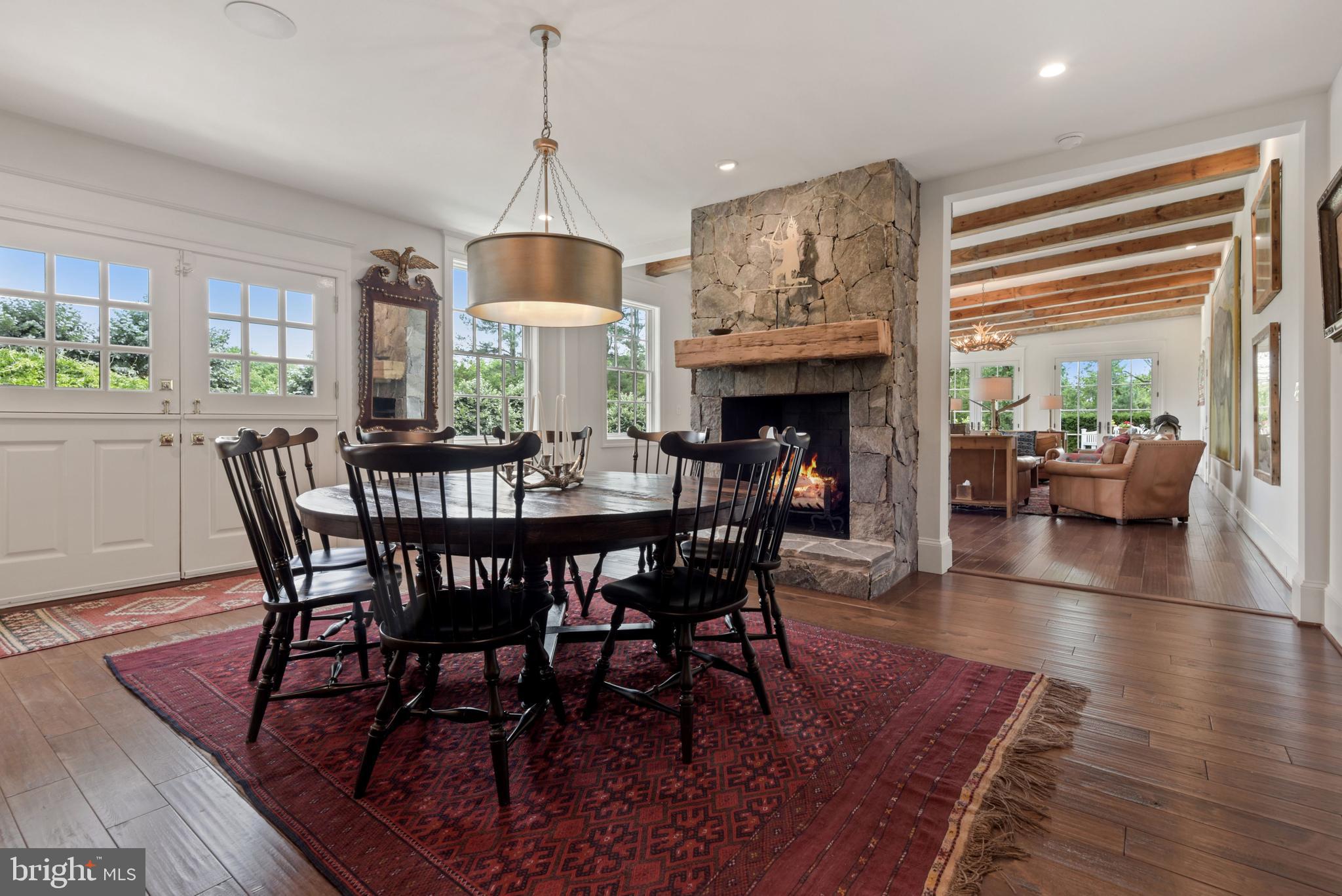 1101 Chain Bridge Road McLean, VA 22101 - Photo 14 of 54 a dining room with furniture window wooden floor