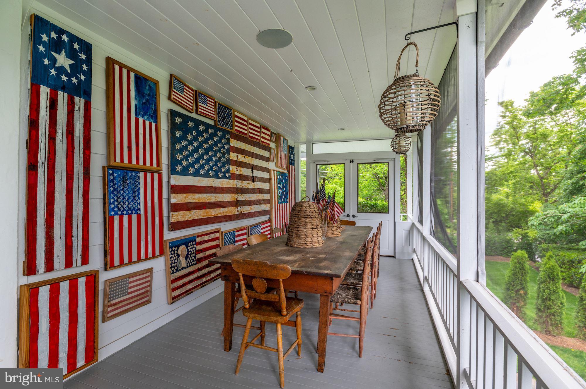 1101 Chain Bridge Road McLean, VA 22101 - Photo 18 of 54 a view of a dining room with furniture window and wooden floor