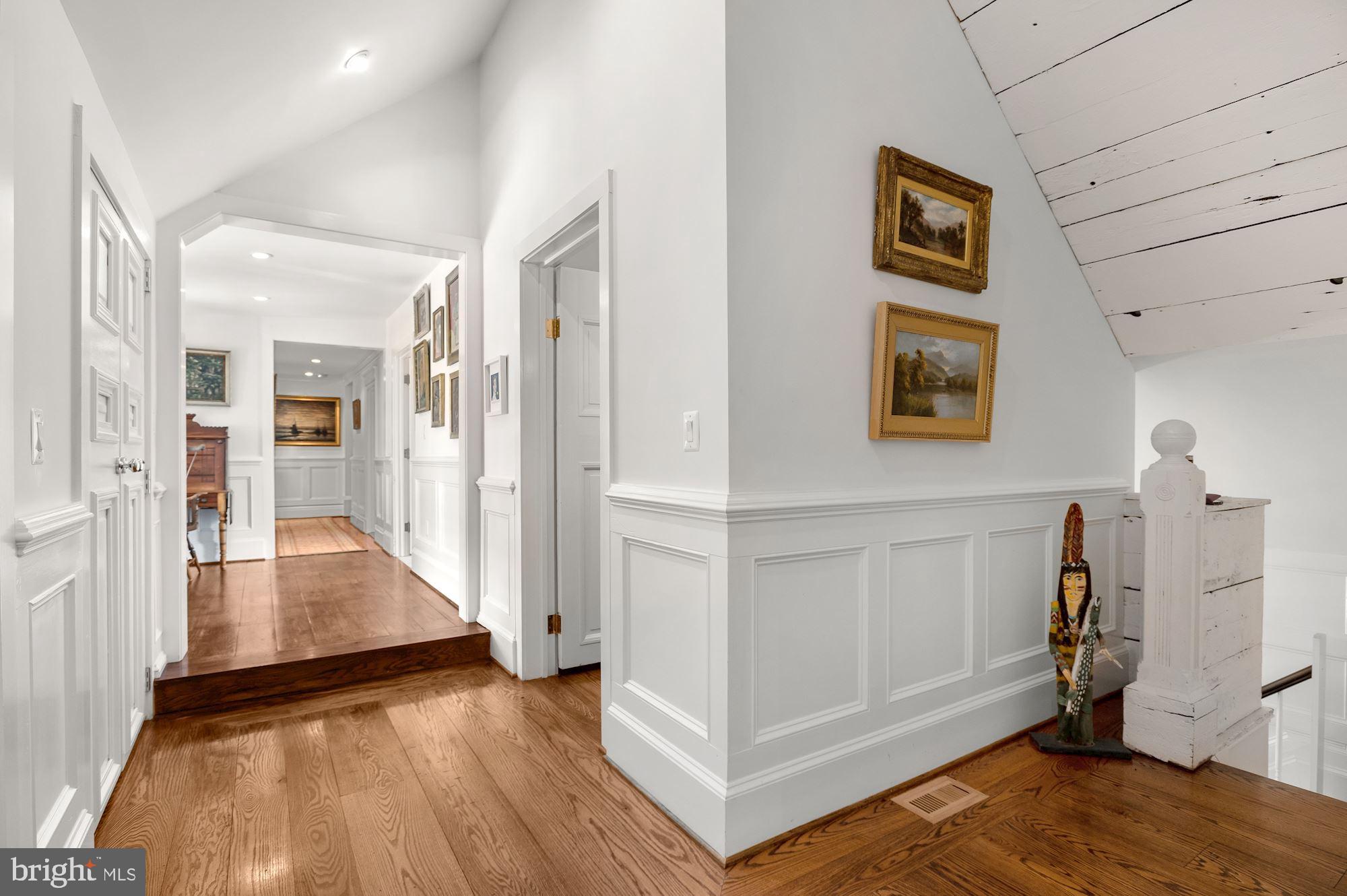 1101 Chain Bridge Road McLean, VA 22101 - Photo 19 of 54 a view of a hallway with wooden floor and cabinet