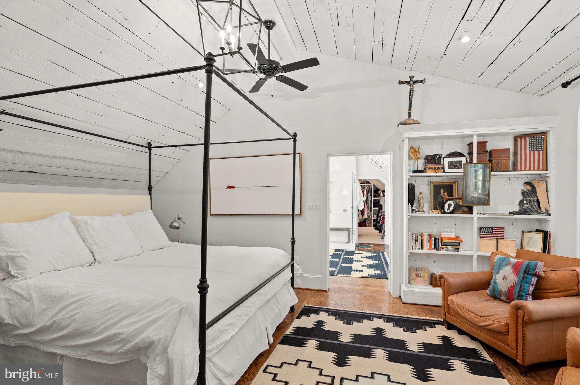 1101 Chain Bridge Road McLean, VA 22101 - Photo 20 of 54 a bedroom with furniture and a book shelf