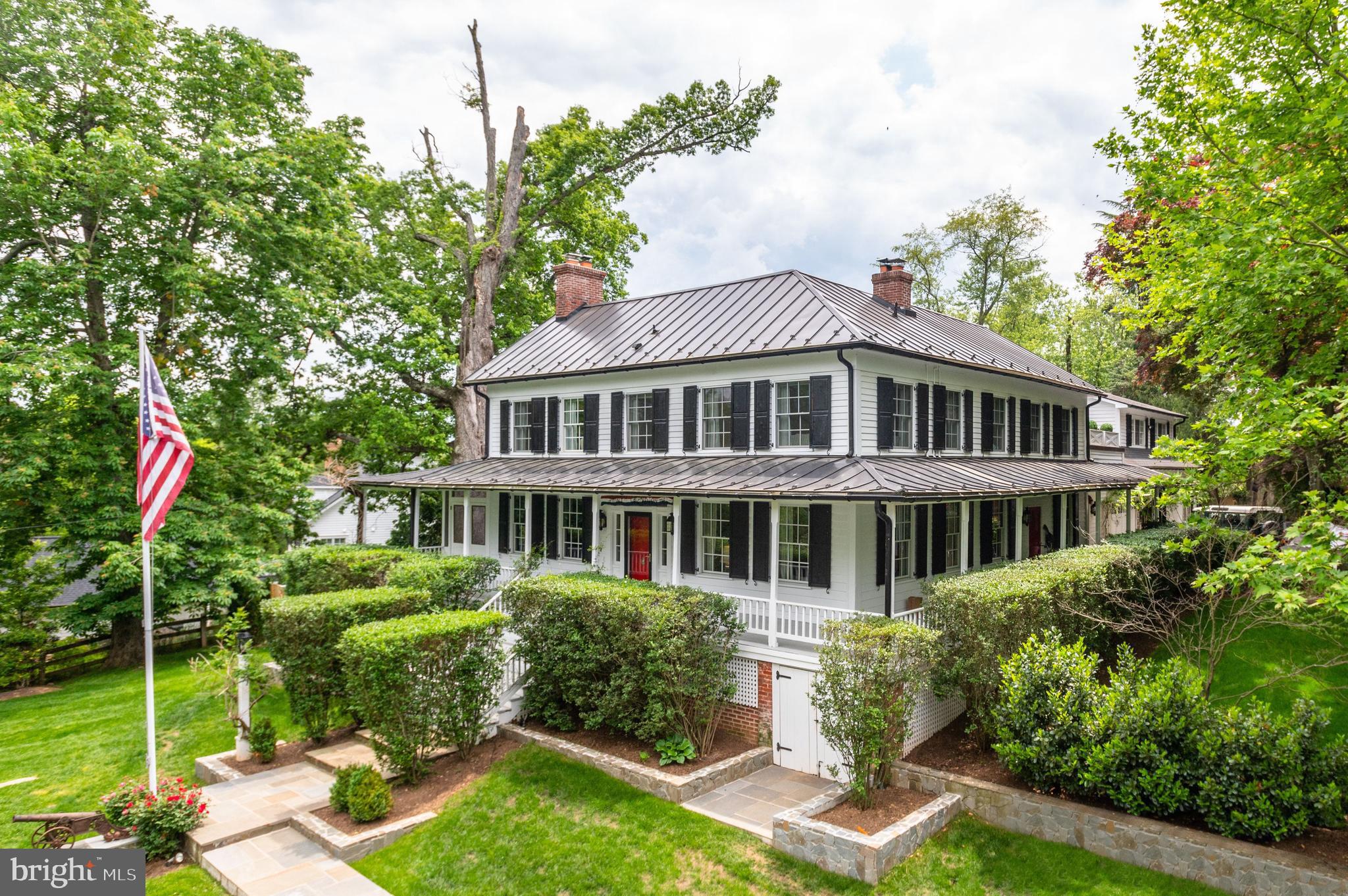 1101 Chain Bridge Road McLean, VA 22101 - Photo 2 of 54 a aerial view of a house with swimming pool and garden
