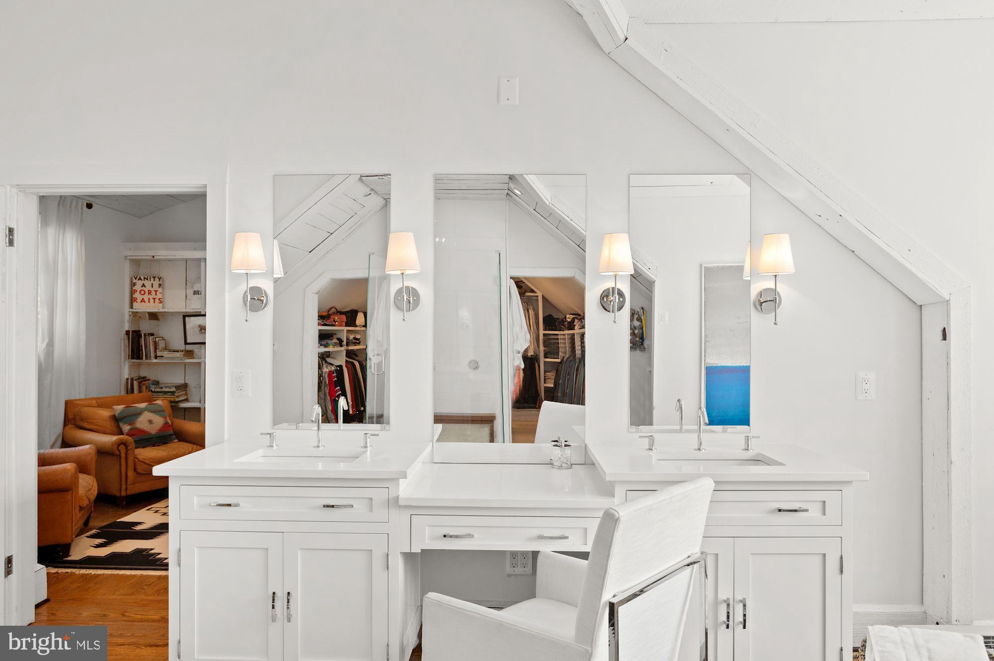 1101 Chain Bridge Road McLean, VA 22101 - Photo 23 of 54 a bathroom with a double vanity sink and a mirror