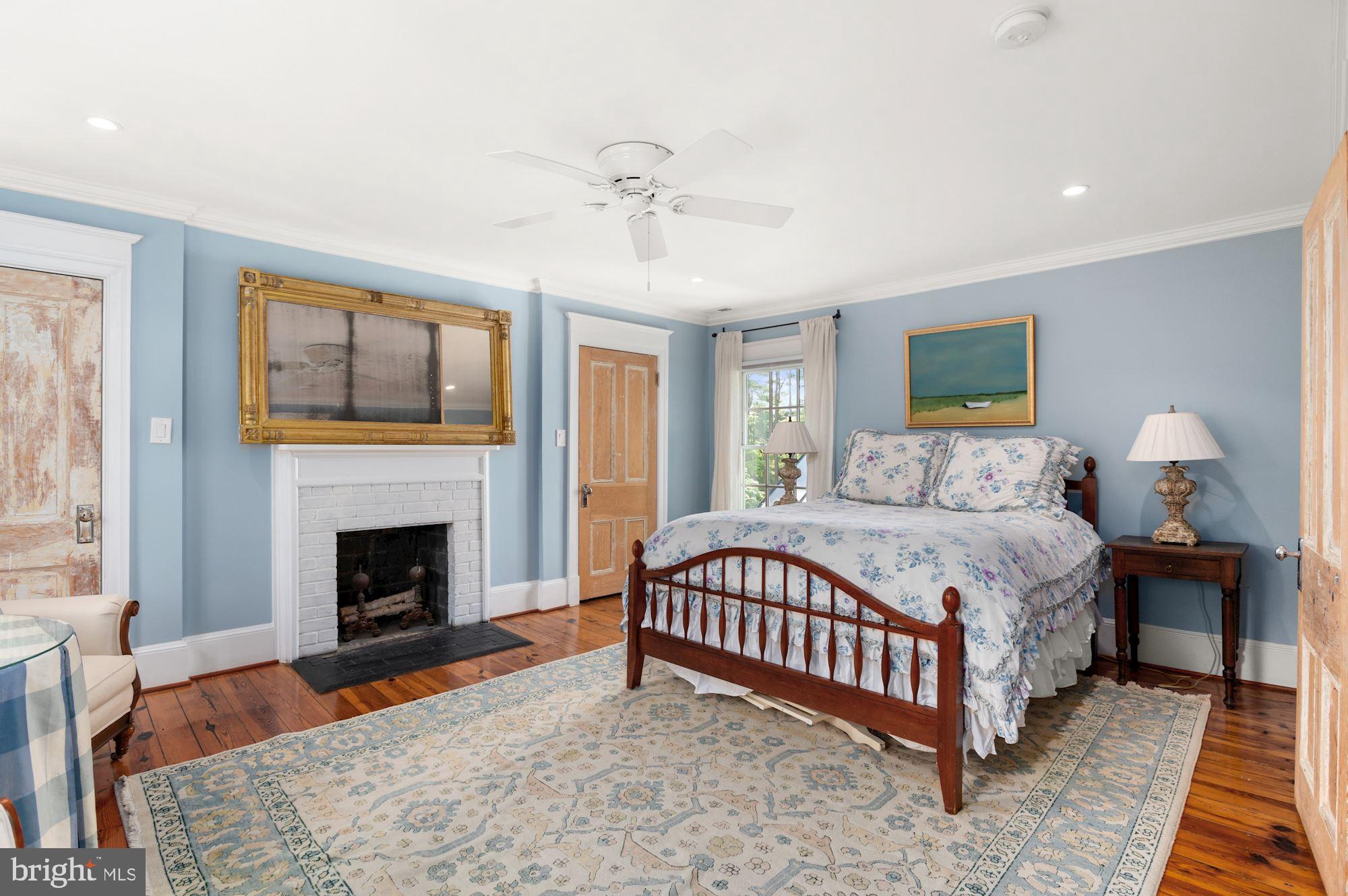 1101 Chain Bridge Road McLean, VA 22101 - Photo 26 of 54 a bedroom with a bed and a fireplace