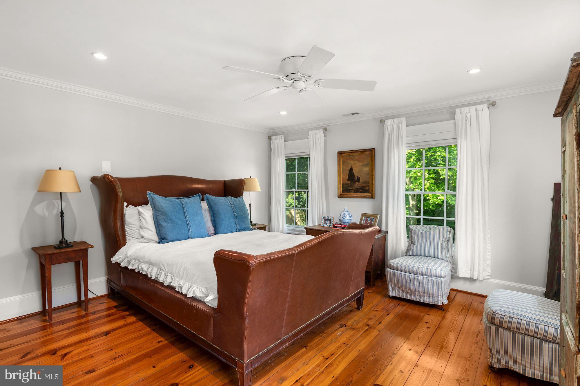 1101 Chain Bridge Road McLean, VA 22101 - Photo 28 of 54 a bedroom with a bed and a couch
