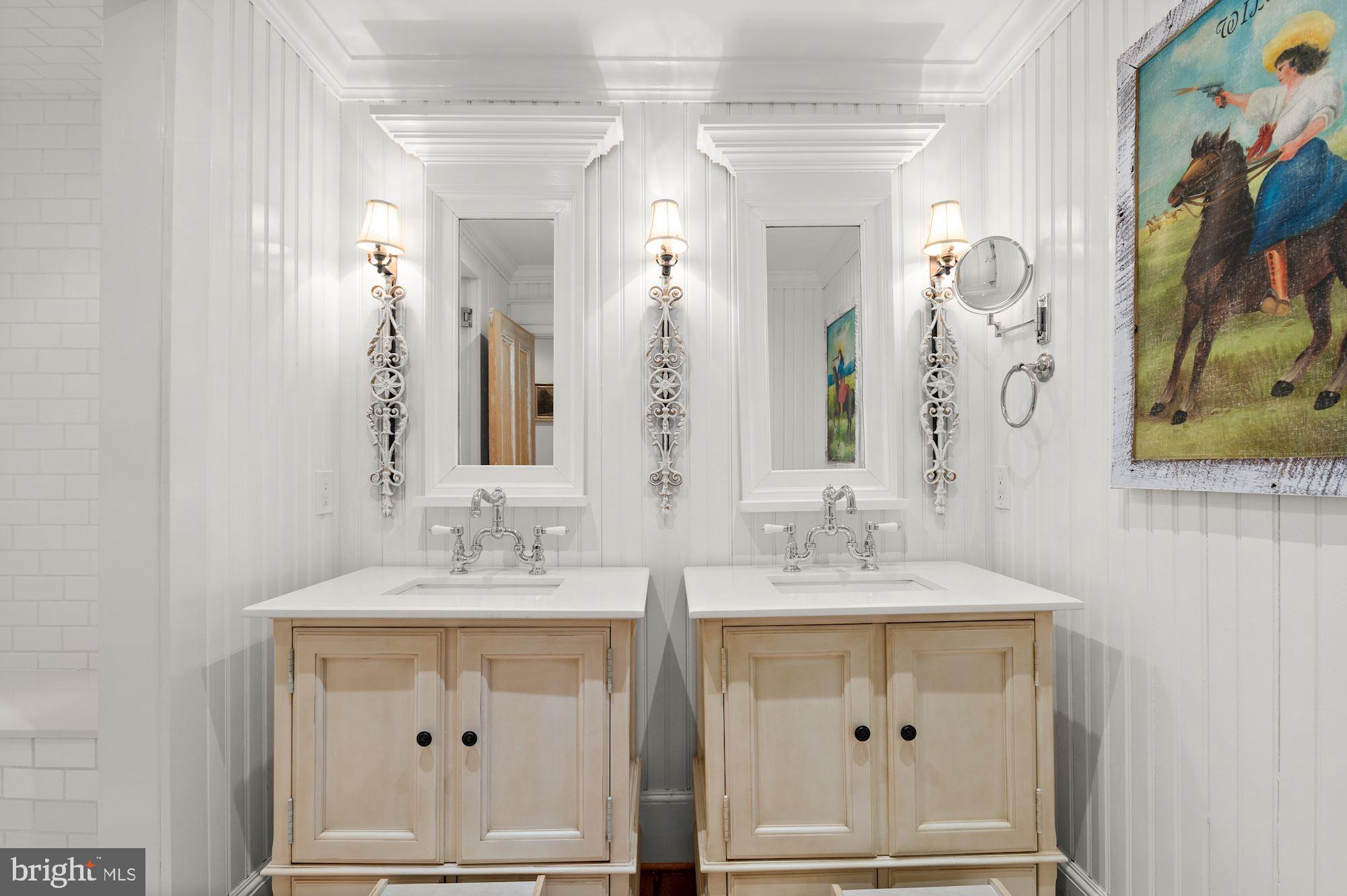 1101 Chain Bridge Road McLean, VA 22101 - Photo 33 of 54 a bathroom with a double vanity sink and a mirror