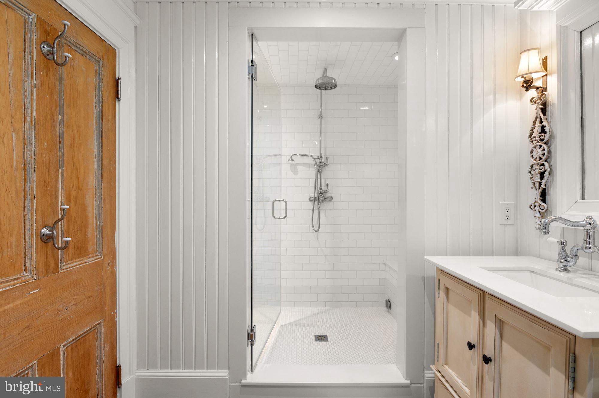 1101 Chain Bridge Road McLean, VA 22101 - Photo 34 of 54 a bathroom with a shower and a sink